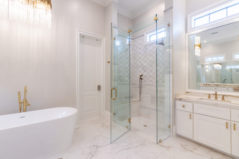Luxury bathroom interior with a freestanding soaking tub and walk-in glass shower